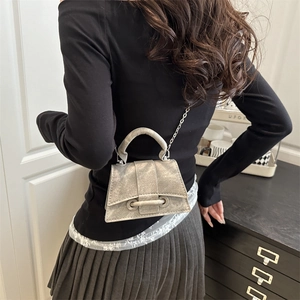 Mini silver-grey trapezoid handbag with metallic chain and sleek top handle style