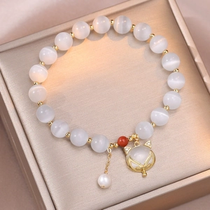 Cat eye stone bead bracelet with a gold fox pendant and natural freshwater pearls