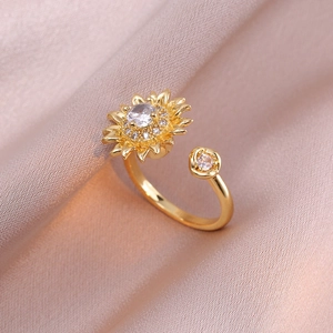 Adjustable gold sunflower ring featuring sparkling zircon crystals on champagne satin