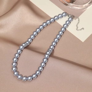 French vintage gray pearl necklace with adjustable metal clasp on elegant silk background