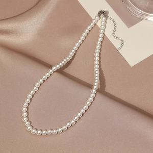Elegant single strand white pearl necklace with adjustable gold-tone lobster clasp