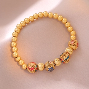 Classic palace style gold beaded bracelet with hollow filigree flower pattern beads