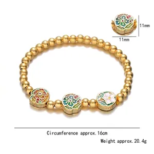 Bracciale a sfere d'oro opaco con ciondoli a fiori in smalto e circonferenza di 16 cm