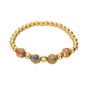 Vintage gold beaded bracelet with hollow enamel filigree charms and blue floral patterns