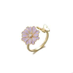 Close-up of adjustable ring with purple enamel daisy and gold butterfly detail