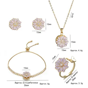 Rotating daisy jewelry set with gold necklace, earrings, bracelet, and ring in purple enamel