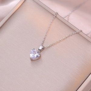 Sparkling silver heart pendant necklace with zircon stone on a premium jewelry box