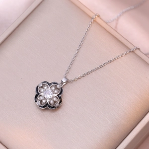 Elegant rotating four-leaf clover flower necklace with zircon stone in silver finish