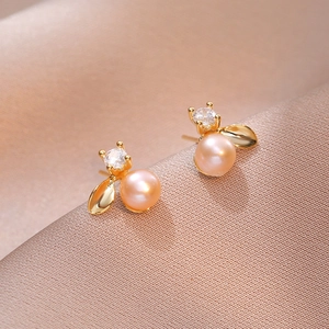 Elegant gold leaf stud earrings with pink freshwater pearl and sparkling white zircon detail