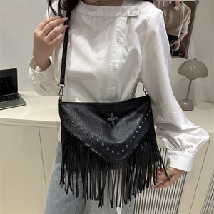 Gothic rivet crossbody bag with silver cross decor and hanging tassels for women