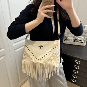 Cream fringe crossbody bag with rivet details and gothic cross on soft faux leather