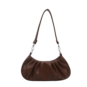 Deep brown pleated underarm bag in crescent moon shape with soft faux leather texture