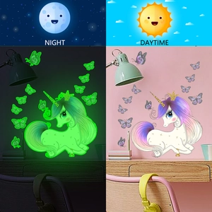 Luminous unicorn and butterflies wall decal comparison between daytime and nighttime glow
