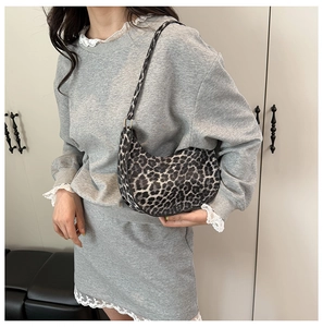Leopard print crescent hobo bag for women featuring stylish black and white patterns
