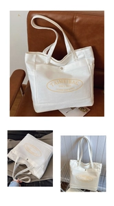Detail of white canvas tote bag featuring yellow logo print and front pocket with snap closure