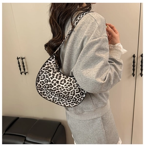Leopard print hobo shoulder bag styled on model to show trendy half-moon design size