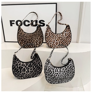 Detailed collection of four leopard print crescent shoulder bags in various color shades