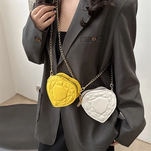 Chic heart-shaped quilted mini bag with gold chain strap in yellow and white color options