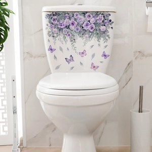 Detailed view of purple floral toilet stickers with butterflies on a marble tile background
