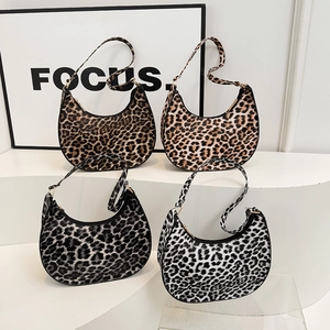 Leopard print crescent hobo bag available in four colors including tan and grey