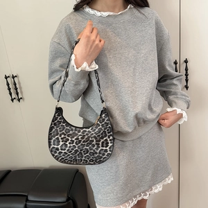 Trendy leopard print crescent bag paired with grey tracksuit and lace detailing