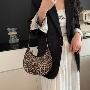 Trendy leopard print crescent hobo bag with adjustable strap for a stylish casual look