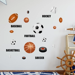Detail view of sports ball wall decals featuring soccer and basketball in a kids room