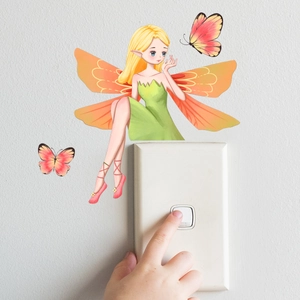 Luminous wall sticker showing a fairy elf and butterflies above a white light switch