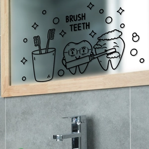 Macro detail of waterproof cartoon tooth decals and Brush Teeth text on bathroom mirror