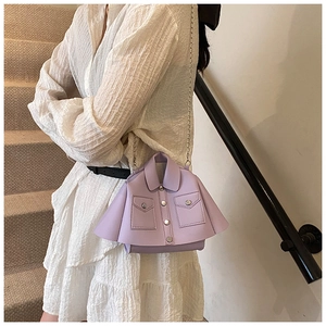 Detail of light purple shirt-style bag with silver chain strap and button accents