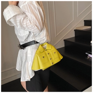 Detail of a bright yellow niche shoulder bag featuring unique shirt-style collar and pockets