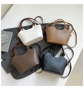 Selection of four fashion bucket bags in white, brown and black with knotted handles
