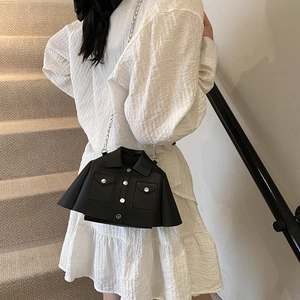 Creative black jacket-shaped crossbody bag with silver buttons and a metal chain strap