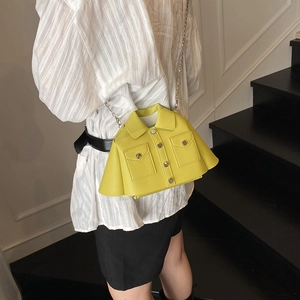 Unique yellow jacket shaped crossbody bag with chain strap and realistic pocket details