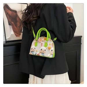 Detail of floral tote bag showing 3D crochet bunny and daisy on white mesh fabric
