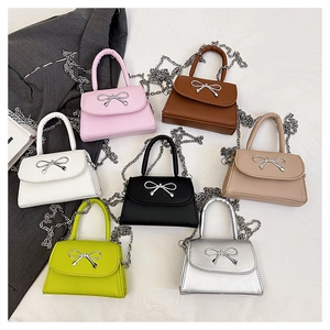 Mini flap square bags with silver bow accents and chain straps in seven vibrant colors