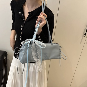 Light blue faux leather baguette bag with white lace trim and blue ribbon bow decoration