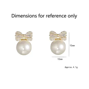 Vintage bow pearl earrings with cubic zirconia in gold plating and white shell pearls