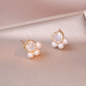 Minimalist heart zircon pearl stud earrings in gold finish presented in a luxury box