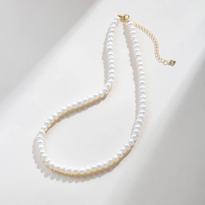 Close-up of S925 sterling silver heart clasp on natural freshwater pearl necklace