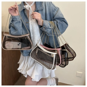 Clear PVC crossbody bag with gold chain showing internal storage for cosmetics