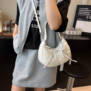 White crescent dumpling crossbody bag with lace bow and pearl charm for women