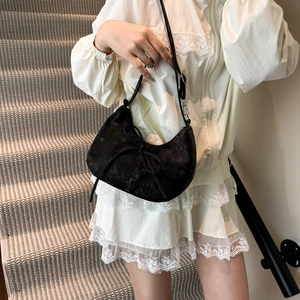 Retro black crescent shoulder bag with bow detail and adjustable strap for women