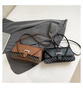 Detail of vintage square crossbody bags with silver metal buckle and patterned leather finish