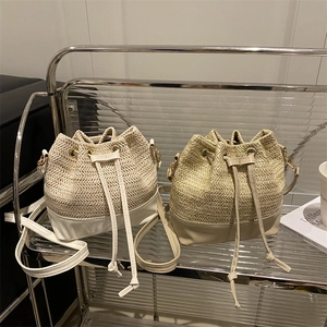 Pastel straw bucket bags with leather trim and drawstring closure in two chic colors