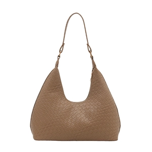 Brown woven leather hobo bag with a minimalist half-moon shape on white background