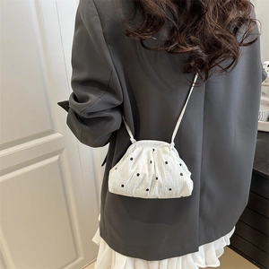 Floral chiffon cloud bag with micro flower embroidery and pleated texture on a model