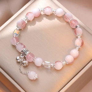 Pink gradient beaded bracelet with moonlight crystals, bell pendant and silver spacers