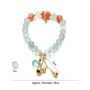 Green fluorite beaded bracelet with gold flower charm and bells in neo-Chinese style
