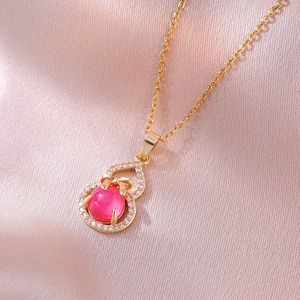 Collana a forma di zucca dorata con opale rosa e ciondolo a fiocco scintillante